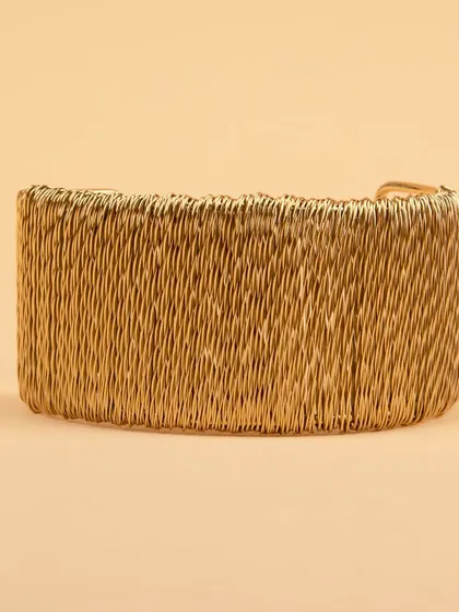 The woven gold cuff bracelet from a different angle.