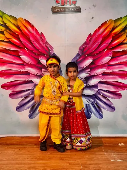 Two little Krishnas ready to celebrate Janmashtami at the studio. Their costumes and playful poses are absolutely heartwarming.