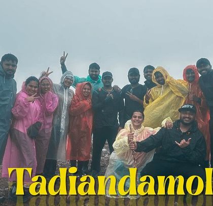 Our group at the summit of Tadiandamol, Coorg's highest peak, enveloped in monsoon clouds.