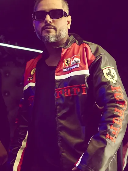 The right swag is part of the show. Rocking this Ferrari jacket, I bring a unique style and confidence to the DJ booth that sets the tone for the entire night.
