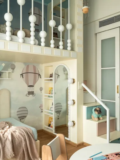 Another view of the playhouse-themed kids' room, showing the loft bed with its charming bead-inspired railings. The space is designed to be a fun and inspiring environment for growth and play.