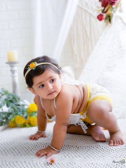 On the move. This photo captures a baby girl in mid-crawl, a perfect memory of this exciting and fleeting milestone.