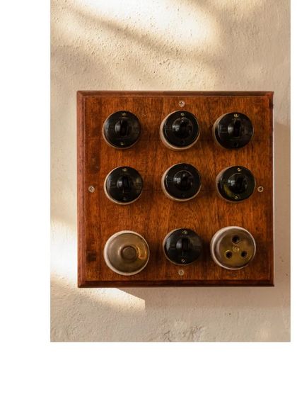 We even upcycle materials to create vintage-looking switchboards. This small detail adds to the authentic, handcrafted feel of the home.