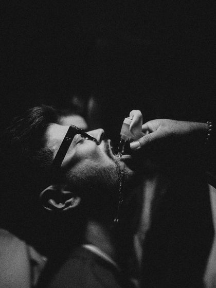 A candid, high-contrast shot from the after-party. This image captures the raw, energetic, and fun-filled moments that happen late into the night.