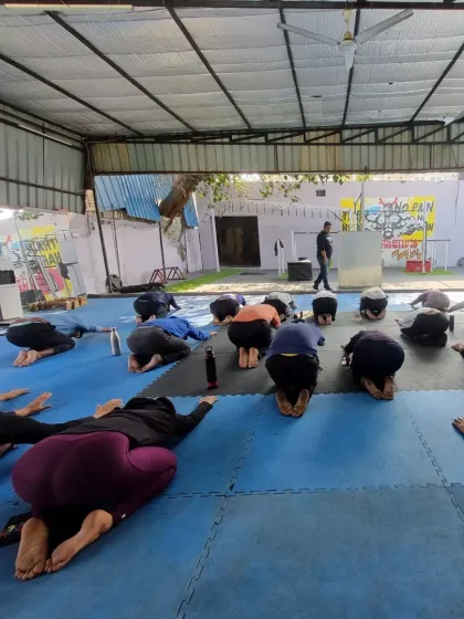 **Focused on pain-free lifting.** Another shot from our shoulder health camp, showing the group engaged in a mobility drill. Our goal is to equip you with the knowledge to train hard and smart for years to come, without pain.
