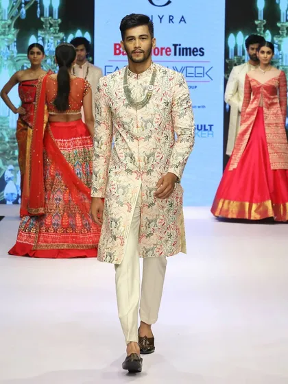 A design from my runway collection, this fully embroidered sherwani in a soft, light color palette demonstrates a blend of intricate craftsmanship and modern fashion. It's a statement piece for any grand celebration.