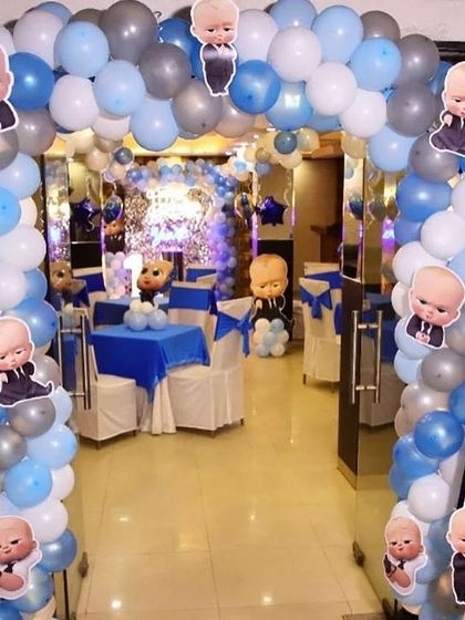 A grand entrance arch for a Boss Baby party, decorated with character stickers.