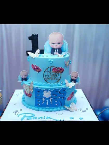A close-up of a Boss Baby themed cake. I can help coordinate with bakers to make sure your cake perfectly matches the party decorations.