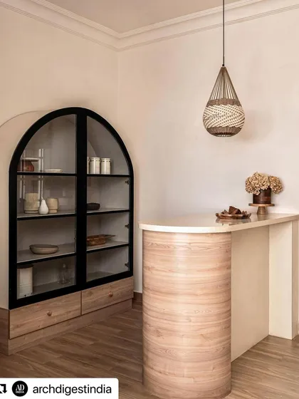 This image, featured in Architectural Digest, showcases the custom bar and arched cabinetry I designed for the Ivy Lane Villa. It highlights my work in preserving heritage while infusing modern functionality.