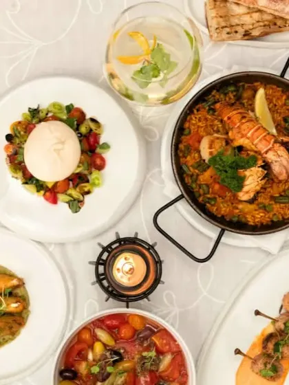 An overhead view of a table filled with our colourful and delicious dishes, showing the artistry and care that goes into each plate.