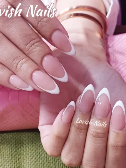 A perfect example of a timeless classic. These elegant, almond-shaped nails feature a flawless French manicure, showcasing precision and a clean, sophisticated finish ideal for any bridal style.