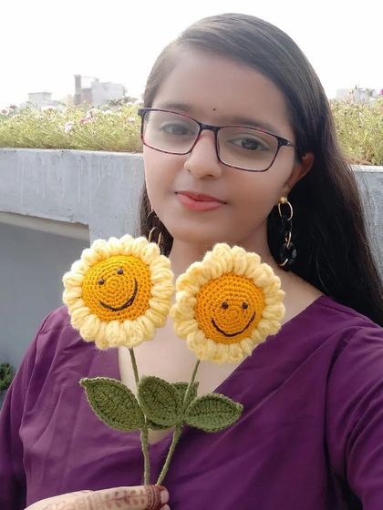Here I am with a couple of our cheerful smiley sunflowers. Being able to create and share these little pieces of happiness is what makes our work so rewarding.
