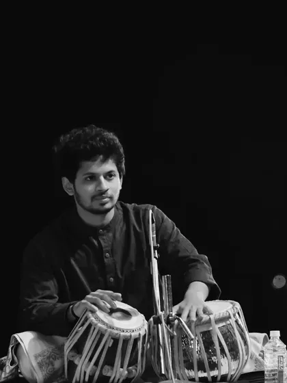 A black and white portrait from a concert. The simplicity of monochrome often captures the deep emotion and focus of a performance.