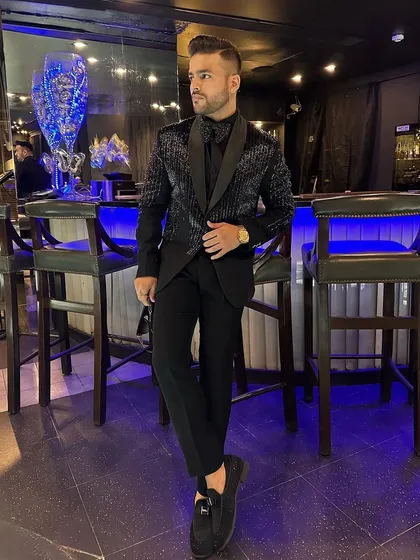 The perfect bar-side look. Our client wears his sequin tuxedo in a stylish, modern setting.