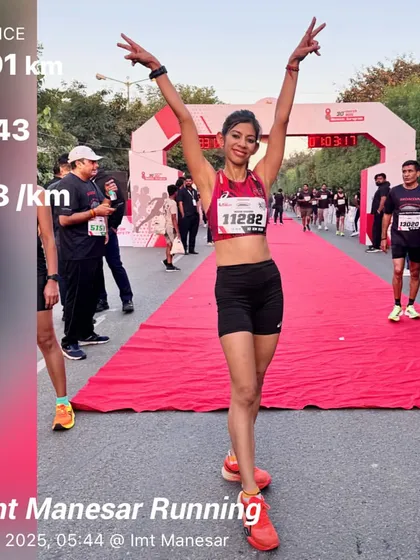 At the finish line of the Honda Manesar 10km race, celebrating a personal best. This was a victory that came from pushing through fatigue and travel.