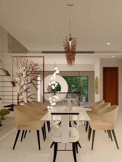 A unique dining setup next to a staircase, featuring an indoor bonsai garden. The design combines natural elements with modern furniture and lighting, creating a peaceful and visually interesting space.