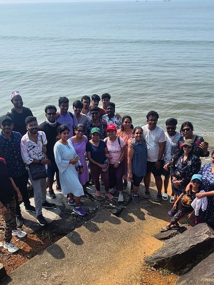 A group photo on the rocky shores of a secluded beach during the Gokarna trek. We explore both popular and hidden spots along the coast.