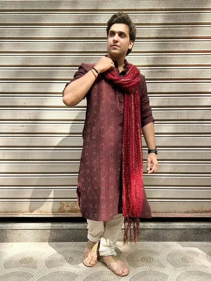 A confident pose in my Diwali attire. This image conveys a sense of modern masculinity rooted in tradition, a popular theme for men's ethnic wear brands.