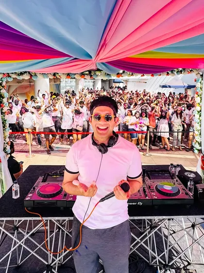 A selfie from the console during a massive Holi party. These events are a riot of colour and sound, and I love getting right in the middle of the action, spinning high-energy Bollywood and commercial tracks for thousands of people.