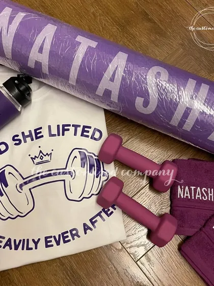 For the fitness enthusiast in your life, we curate motivational workout sets. This collection includes a personalized yoga mat, a custom t-shirt, matching towels, and a sipper bottle to inspire their fitness journey.