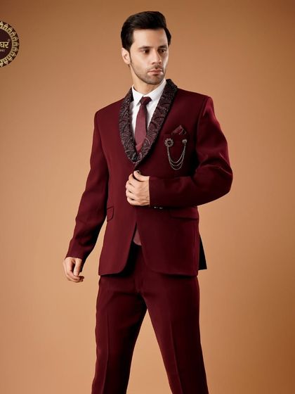 Embrace tradition in style. A full view of the maroon three-piece suit, a perfect blend of classic tailoring and ethnic detail.
