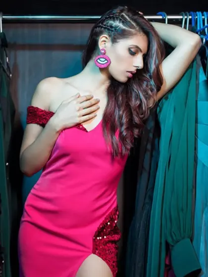 A close-up of the pink dress look, focusing on the attitude and the statement eye-shaped earring. It’s these little details that bring a whole look together.