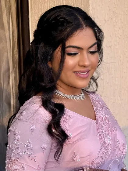 A close-up showing the subtle shimmer on the eyes and the flawless base. The makeup is designed to be picture-perfect.