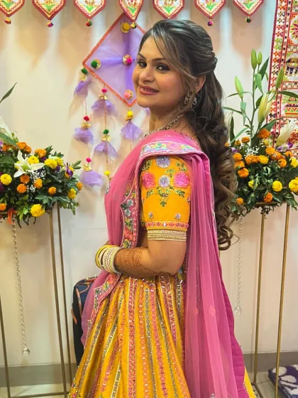 A full-length shot of the client, her colorful outfit perfect for a mehendi or sangeet.