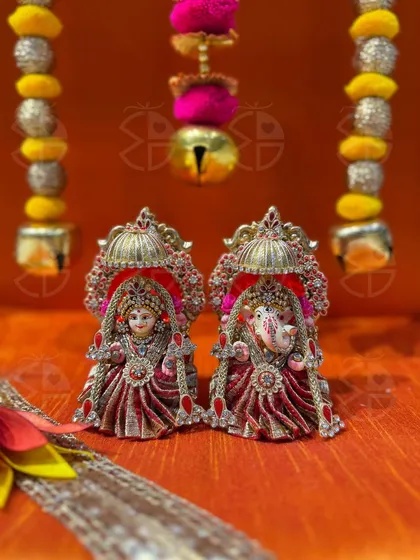 For your most sacred rituals, I offer these beautifully detailed Lakshmi and Ganesha idols. Dressed in intricate red and silver poshak, they are designed to be the divine centerpiece of your Diwali or Karwachauth pooja, bringing blessings and prosperity into your home.