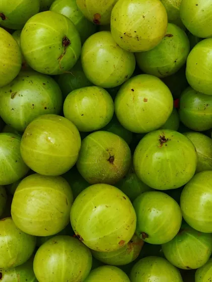 Fresh amla, or Indian gooseberry. I use these to make a healthy and tangy amla pickle, which is full of vitamins.