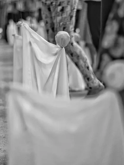 A close-up view of the simple cloth puppets made by the children. With just a piece of fabric and a ball for a head, a character is born.