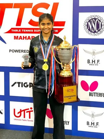 A moment of triumph for Swara Jangade, holding the championship trophy after winning gold at the Table Tennis Super League. She was also named the Best U-17 Girls Player of the tournament.