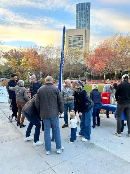 This photo shows the community event where I was sketching in Boston. It's wonderful to be part of public gatherings, drawing the crowd and the city skyline in the background.