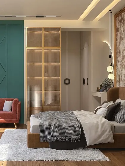 This wider angle reveals more of the room's design, including a bold teal accent wall and a glass-and-wood partition for the wardrobe, adding layers of color and texture to the space.