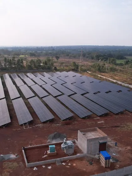 The completed 1.3 MW solar farm, featuring a dedicated control station for monitoring and managing the power output. This is a complete turnkey solution for large-scale energy generation.