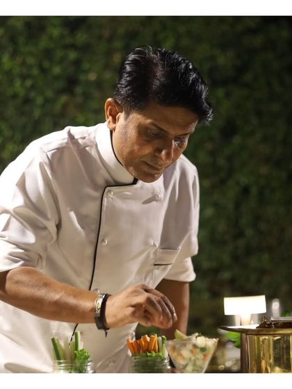 Our senior chef meticulously arranges a salad, showcasing his experience and attention to detail. The leadership of our seasoned chefs ensures the highest quality across all our culinary offerings.
