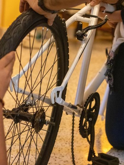 A close-up of a bicycle's rear wheel and derailleur during a disassembly session. It's in these details that kids truly understand how machines work.