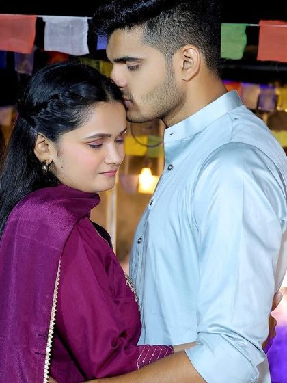 A tender moment from a couple's shoot at our campfire set, complete with Tibetan prayer flags for a unique, bohemian touch.