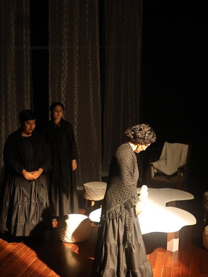 An ensemble moment from "The House of Bernarda Alba." The all-women cast powerfully portrays the complex relationships and emotional struggles within the family.