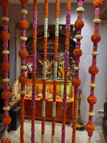 Another view of our traditional floral torans, perfect for decorating doorways and puja areas during festivals like Diwali or Navratri.