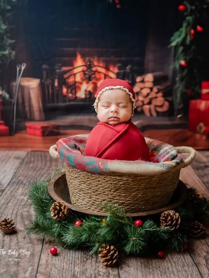 Get into the holiday spirit with a festive Christmas-themed newborn shoot. This setup features a cozy fireplace backdrop, creating a warm and joyful scene.