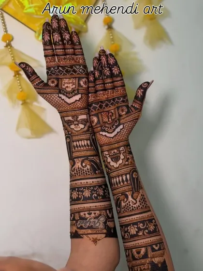 This design combines geometric patterns with traditional figures and floral bands. The contrast between light and dark henna application makes the artwork stand out.