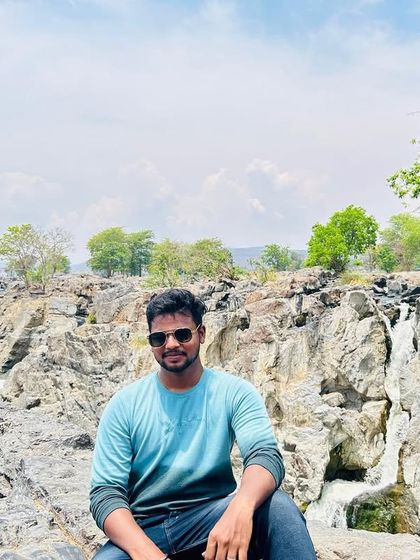 Posing on the rocks overlooking the main gorge at Hogenakkal. The scale of the place is impressive.