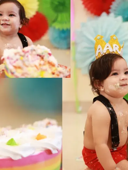 More fun from the first birthday cake smash. The colorful background and the baby's happy, messy face make for unforgettable photos.