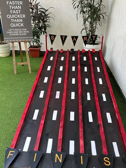 A custom-made racetrack for the kids to play with their toy cars. This interactive element was a huge hit at our race car-themed party.