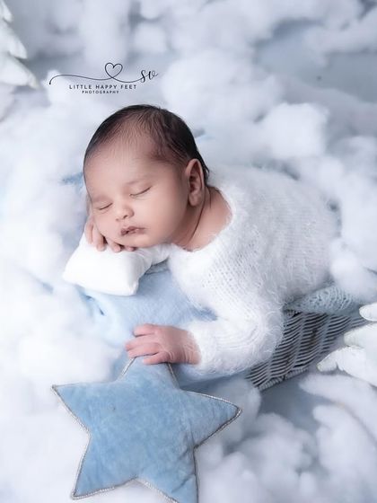 Reaching for the stars from a bed of clouds. This setup symbolizes the limitless potential and dreams you have for your little one.