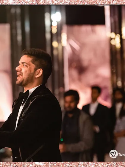 A candid shot of the groom singing his heart out during his performance. Pure emotion!