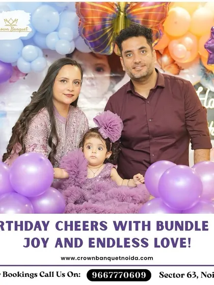 Birthday cheers with a bundle of joy. This adorable family photo is set against a vibrant purple balloon backdrop, highlighting our ability to create a colorful and festive setting for your child's party.
