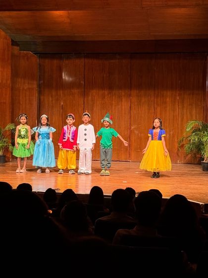 Snow White and her friends share a moment on stage during our fairytale medley.