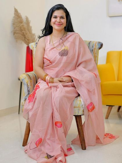 A full view of my pink hand-painted organza saree from Label L F. It's such a dreamy and artistic piece, perfect for a special occasion.